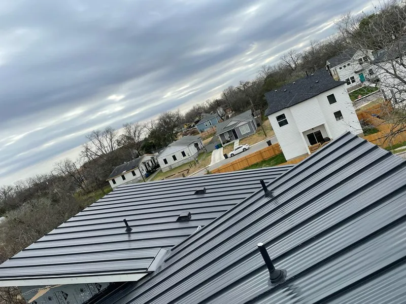 Standing seam metal roof panels with vents for Skylight Repair in Asheville